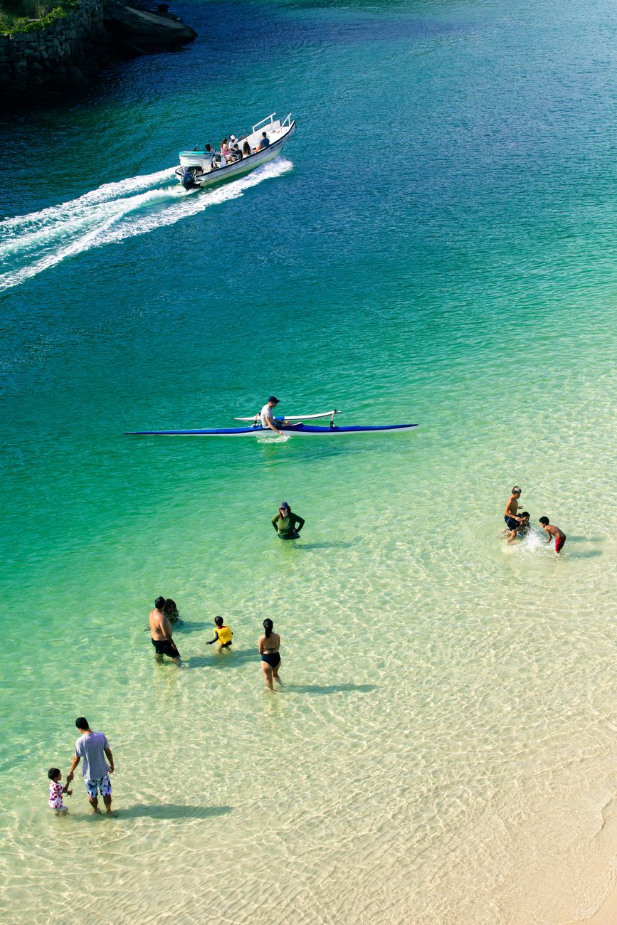 family fun at tropical beach with kayaking