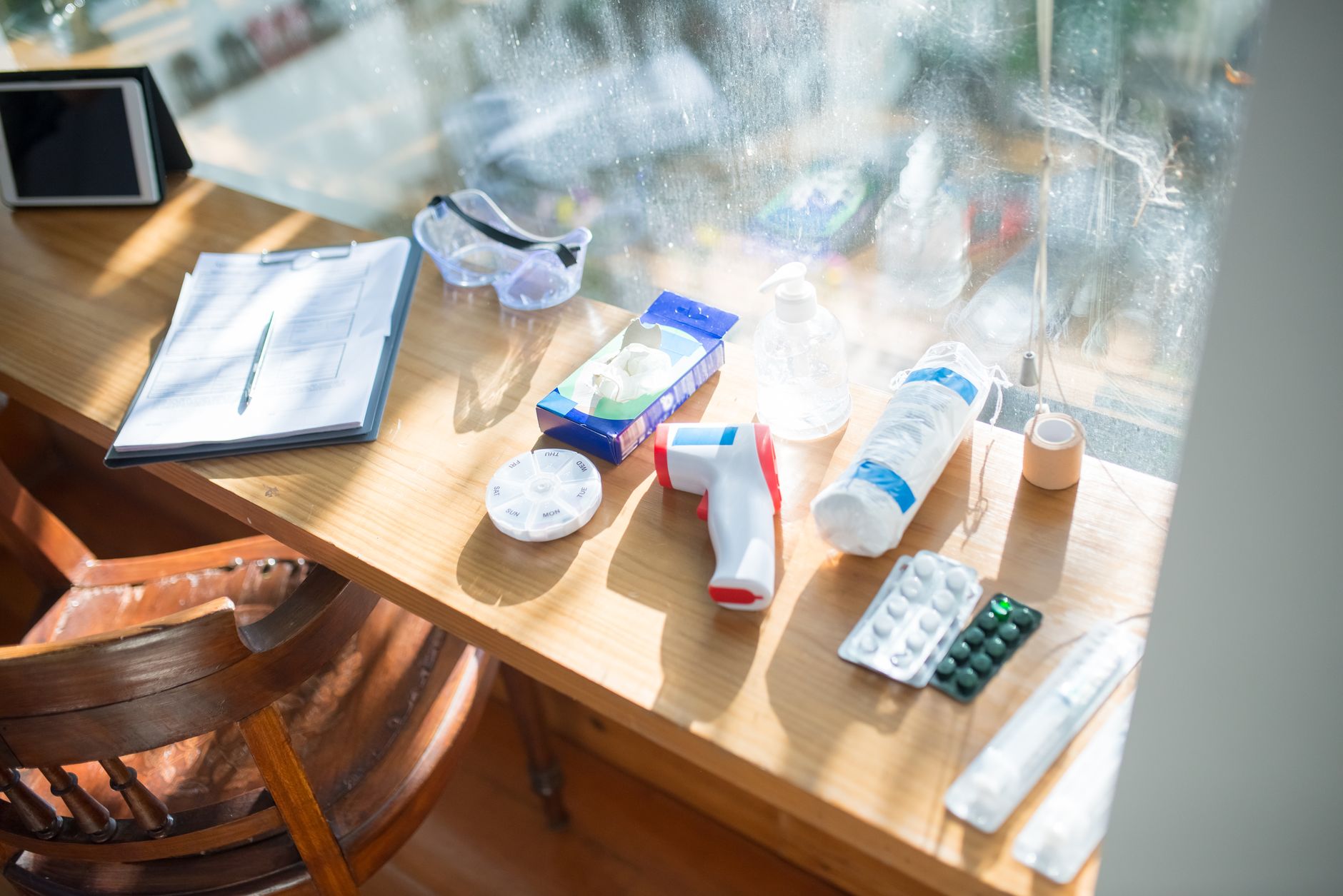 medical chat on clipboard and various medical items on the table